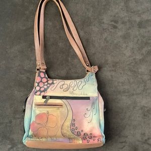 Hand-painted, soft leather Anuschka shoulder bag. Floral themed.